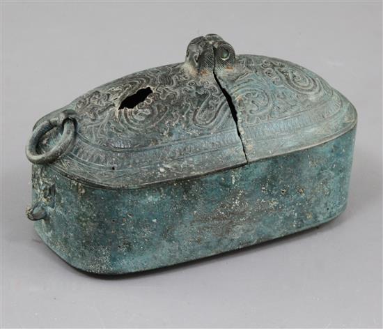A Chinese archaic bronze portable lamp, Han dynasty, 2nd century B.C.- 2nd century A.D. 15cm long, hole to cover